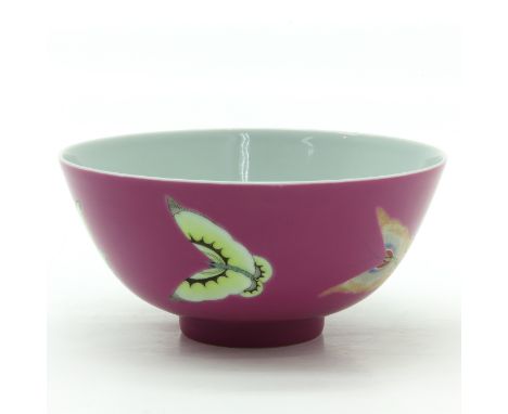 Pink ground with Famille Rose enamels, marked on bottom with double ring and 6 characters, 14 cm. in diameter. 