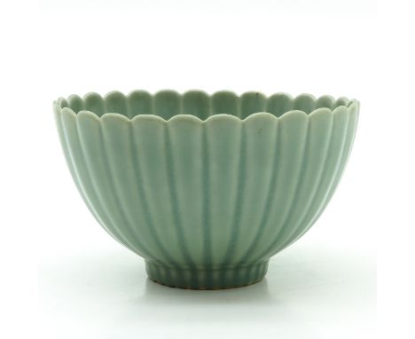 On small circular foot, marked on bottom with double ring and 6 characters, 18 cm. in diameter.