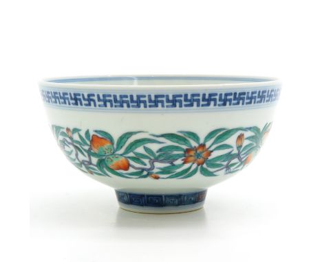 Depicting peaches and flowers, marked on bottom with double ring and 6 characters, 14 cm. in diameter.