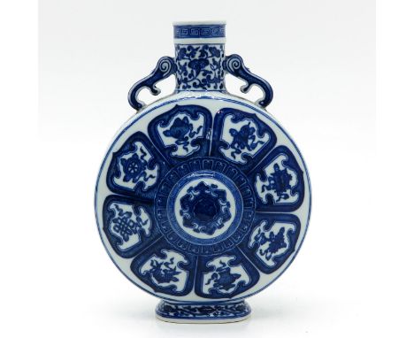 Depicting Chinese valuables, marked on bottom with seal mark, 31 cm. tall.