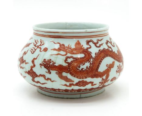 Depicting dragons and clouds, marked on bottom with double ring and 6 characters, 23 cm. in diameter, hairline.