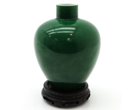 Green glaze, marked on bottom with double ring and 6 characters, 18 cm. tall.