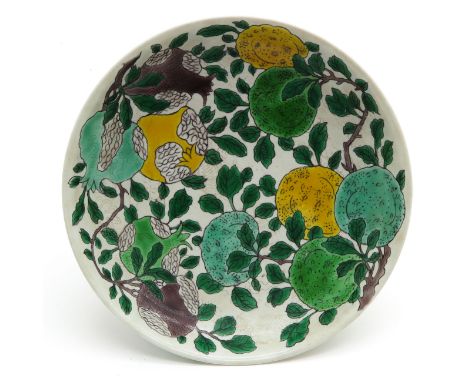 Depicting colored fruit with sgraffito background, marked on bottom with double ring and 6 characters, 25 cm. in diameter.