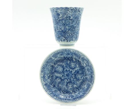 Floral decor, marked on bottom with double ring and flower, saucer is 15 cm. in diameter.