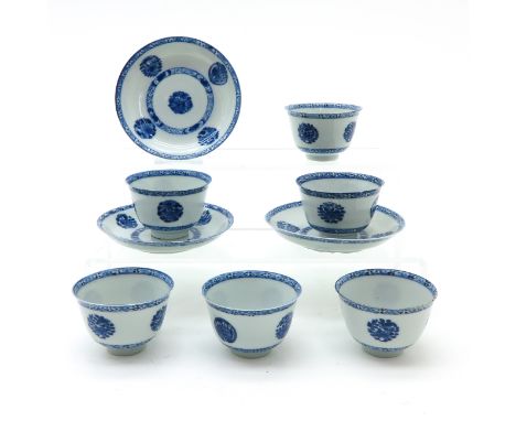 Floral decor, marked on bottom with double ring, saucers are 11 cm. in diameter, chip.