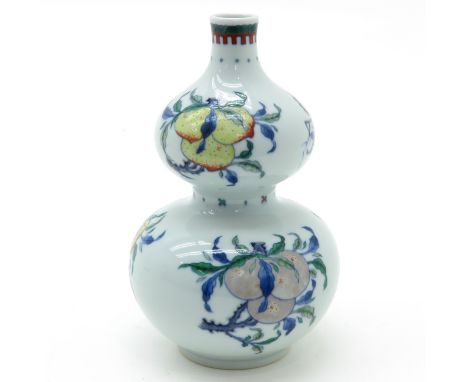 Depicting fruit , marked on bottom with double ring and 6 characters, 20 cm. tall.