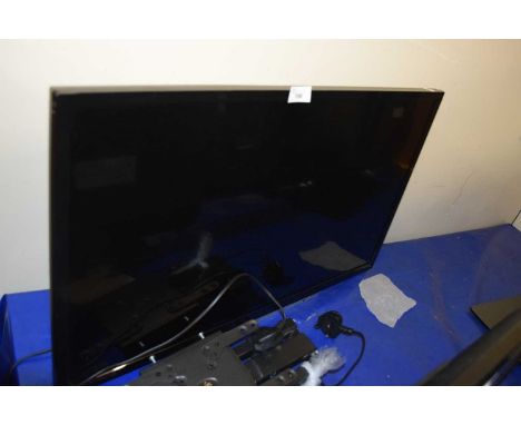 A Toshiba flat screen TV with wall mounting bracket