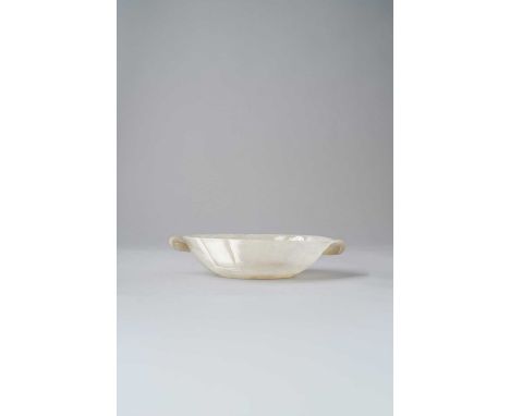 A WHITE JADE MUGHAL-STYLE OVAL BOWL18TH/19TH CENTURYThe thinly carved and highly polished bowl with everted sides, finely car