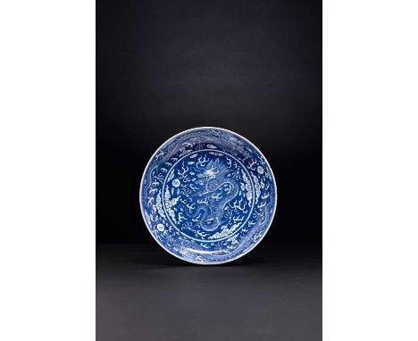 A CHINESE IMPERIAL REVERSE-DECORATED BLUE AND WHITE ‘DRAGON’ DISHSIX-CHARACTER JIAQING SEAL MARK AND OF THE PERIOD 1796-1820W