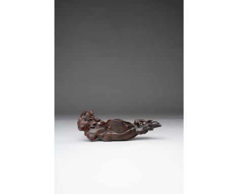 NO RESERVEλ A RARE CHINESE RHINOCEROS HORN ‘ZHANG QIAN ON A RAFT’ POURING VESSEL 17TH/18TH CENTURY    Carved as a large log r