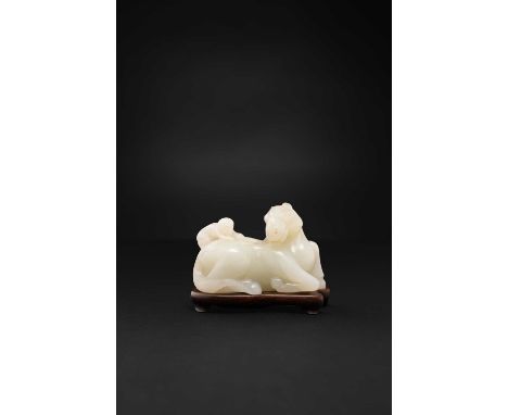 A CHINESE WHITE JADE 'MONKEY AND HORSE' GROUP18TH CENTURYCarved in the form of a recumbent horse, its head turned to the righ