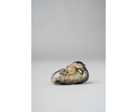 A CHINESE JADE CARVING OF A MANDARIN DUCKMING DYNASTYCarved sitting with its feet tucked under its body and its head resting 