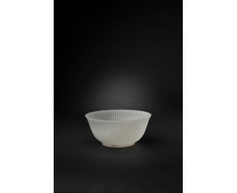 A CHINESE WHITE JADE MUGHAL-STYLE FLUTED BOWL18TH CENTURYThe stone thinly carved and of matt translucence, with narrow flutes