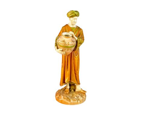 Beautiful porcelain figurine with alabaster colored body, sienna colored galabeya, and olive green turban. Gold finish.Modele