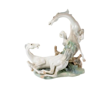 Large porcelain sculpture of two horses playing, gloss finish. Lladro backstamp. Artist: Fulgencio GarciaIssued: c. 1989Dimen