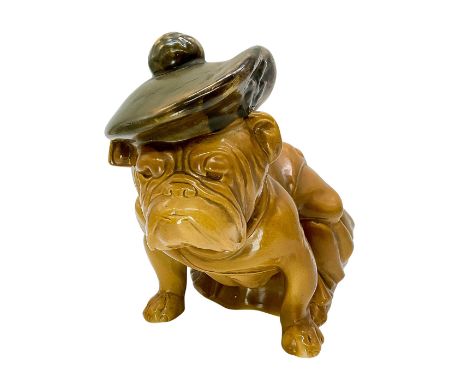 Hand made with khaki glaze. Rare model, dog with Tam O'Shanter and haversack. Royal Doulton backstamp. Issued: c. 1918-1925Di