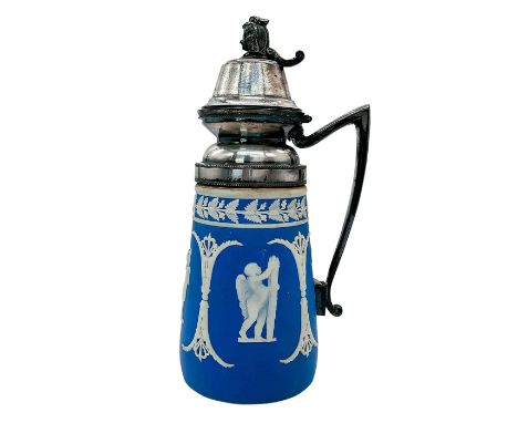 Pale blue jug decorated in a white relief with neoclassical angel scenes and intricate patterns around border. Complemented w