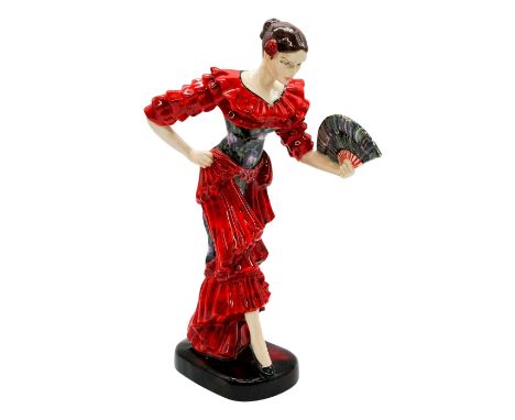 A glossy figure of a lady in a ruffled red flamenco dress with a floral bodice and back, holding a matching fan.'Artist origi