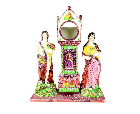 Beautifully decorated with pink splash lustre. Depict two figures to either side of clock tower in classical attire. Dixon an
