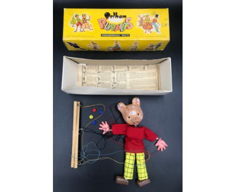 A Rupert the Bear Pelham puppet with box and instruction sheet, 26cms h.Condition ReportGood condition, no noticeable issues.