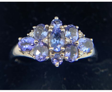 A blue gem set ring mounted in 9ct white gold. Size S, weight 3gms.