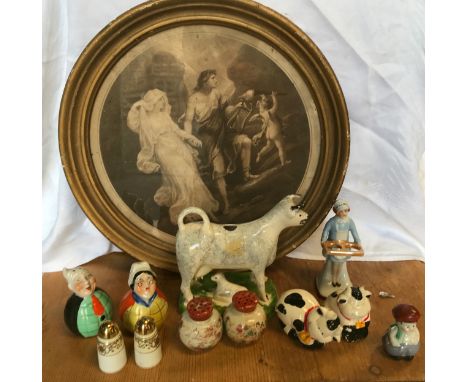 A collection of ceramic salt and pepper pots together with a Leeds classical creamware cow creamer together with a circular g
