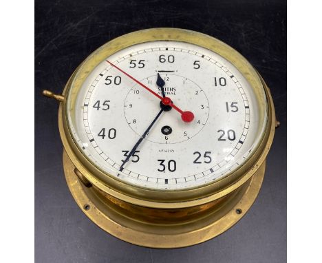 A Smiths Astral Brass Ship's Clock with minutes outside  and hours inside. Serial number AP160174. Dial diameter 20cms, brass