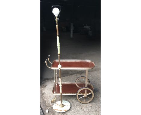 Onyx and brass standard lamp 148cms h and a brass effect two tier serving tea trolley.Condition ReportGood condition, no noti