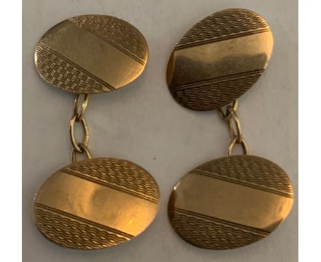 9ct gold cufflinks with engine turned decoration.Condition ReportGood condition.