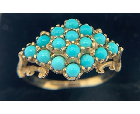 A turquoise dress ring set in 9ct yellow gold. Size O. 2.5gms.