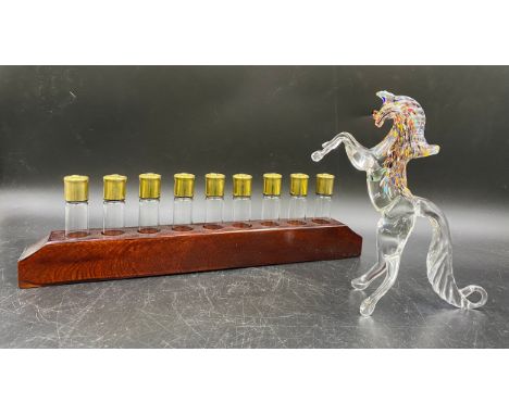 A novelty numbered peg finder for game shooting, shot glasses in the shape of cartridges with "Hull Cartridge" metal screw on