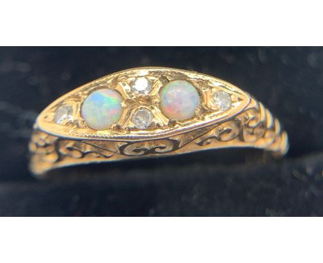 A 9ct gold opal and diamond set ring, size M, 2.6gms weight.