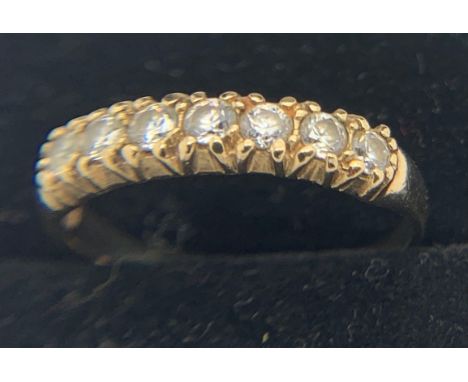 9ct gold ring set with clear stones, size K, 1.4gms weight.Condition ReportGood condition.