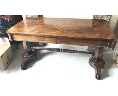 A Regency rosewood sofa table with single drawer to front of each side. 67 d x 72cms h.Some veneer loss. Buttons missing to f