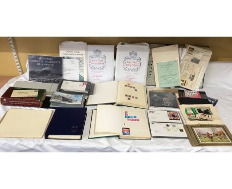 A collection of stamps and First Day covers including Channel Tunnel Philatelic Document, Royal Mail stamp album supplements 