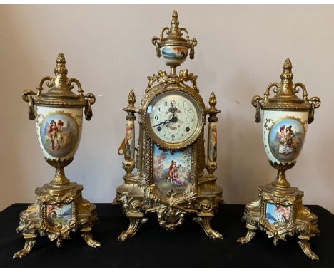 A 20thC decorative French brass and ceramic clock garniture. Clock 42cms h, vase 33cms h.Condition ReportGood condition.