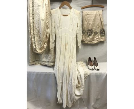 A collection of vintage wedding items to include a heavy cream silk train with glass beads and sequin trim, a cream silk unde