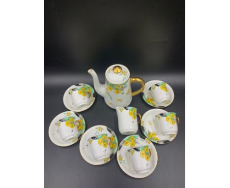 Shelley coffee service, 6 cups and saucers, jug and coffee pot.Condition ReportCrack and chip to jug, crack to one cup.
