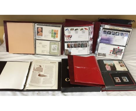 Stanley Gibbons Collectors World Albums, three albums of First Day Covers and stamps including Jersey stamps collection and a