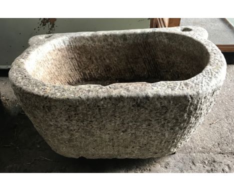 A carved stone watering trough. 82cm w x 57cm d x 36cm h.Condition ReportChip to top front inner rim, overall in a good condi