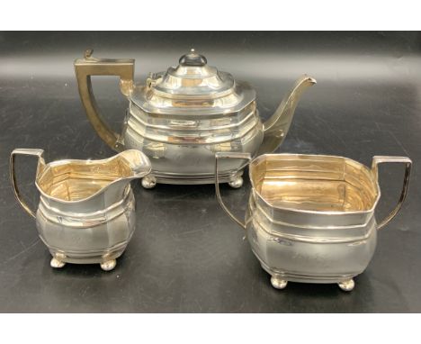 Three piece silver tea service inscribed to front. Birmingham 1915, 1917 maker George Nathan and Ridley Hayes. Total weight 9