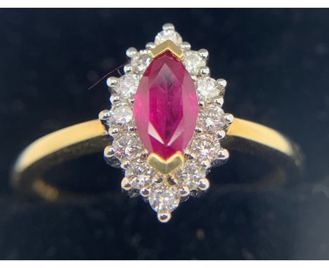 An 18ct gold ruby and diamond cluster ring. Size R. Total weight 4gms.Condition ReportGood condition.