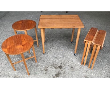 A teak nest of 5 side tables. Large 63 x 43 x 77cms h.Condition ReportGood condition. Larger table sun faded to top.