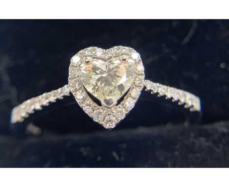 An 18ct white gold heart shaped diamond ring. Size O 2.9gms.Condition ReportGood condition.