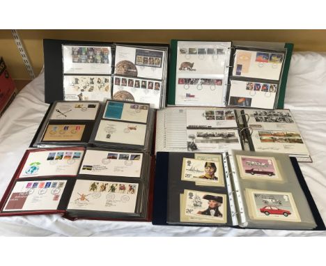 A collection of six albums containing Royal Mail first day covers, envelopes, cards and an album of British and European post