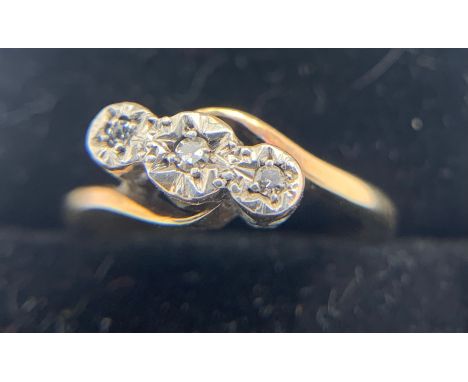 A 9ct and platinum ring set with three diamond, size I, weight 2gms.