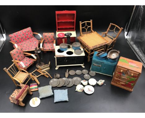 Dolls house furniture selection, tinplate dresser, stove and cupboard, fireside tools, fire front, tinplate pans and plates, 