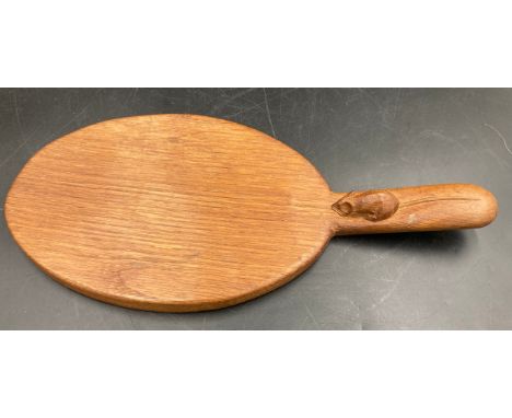 A Robert Thompson 'Mouseman' English oak paddle cheeseboard, carved mouse signature, 37.5cm l.