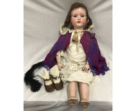 An Armand Marseille large pot headed doll with open/close blue eyes and moveable joints. 77cms h.Condition ReportPot head in 