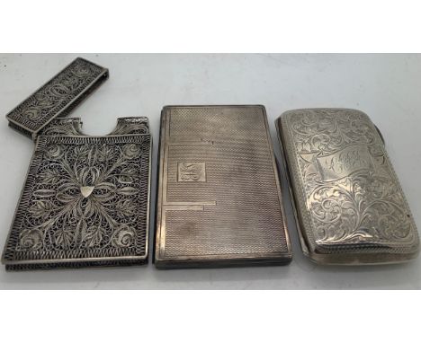 A hallmarked silver cigarette case with foliate scroll engraving Chester 1899 maker William Aitken, a card case with engine t